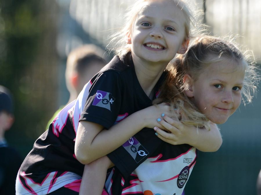 Two girls smiling together at the M11 Monday Girls Centre in Dudley